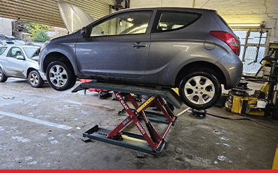 What’s the Difference Between a Portable Car Lift & a Full-Size Post Lift
